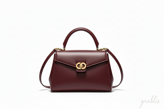 Brown handbag with a gold clasp on a white background