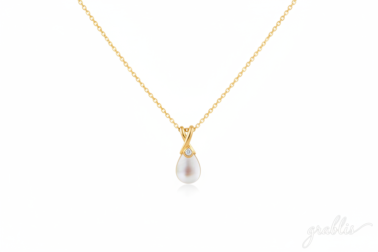 gold color necklace with a pearl pendant