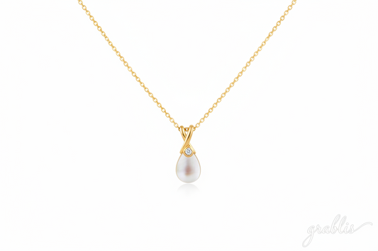 gold color necklace with a pearl pendant